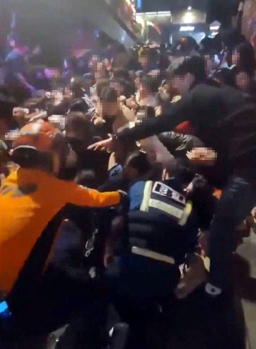 Emergency workers grappled to pull those who needed help from the crowd