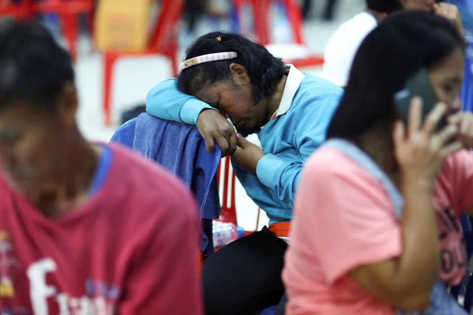 A devastated woman crying at the scene