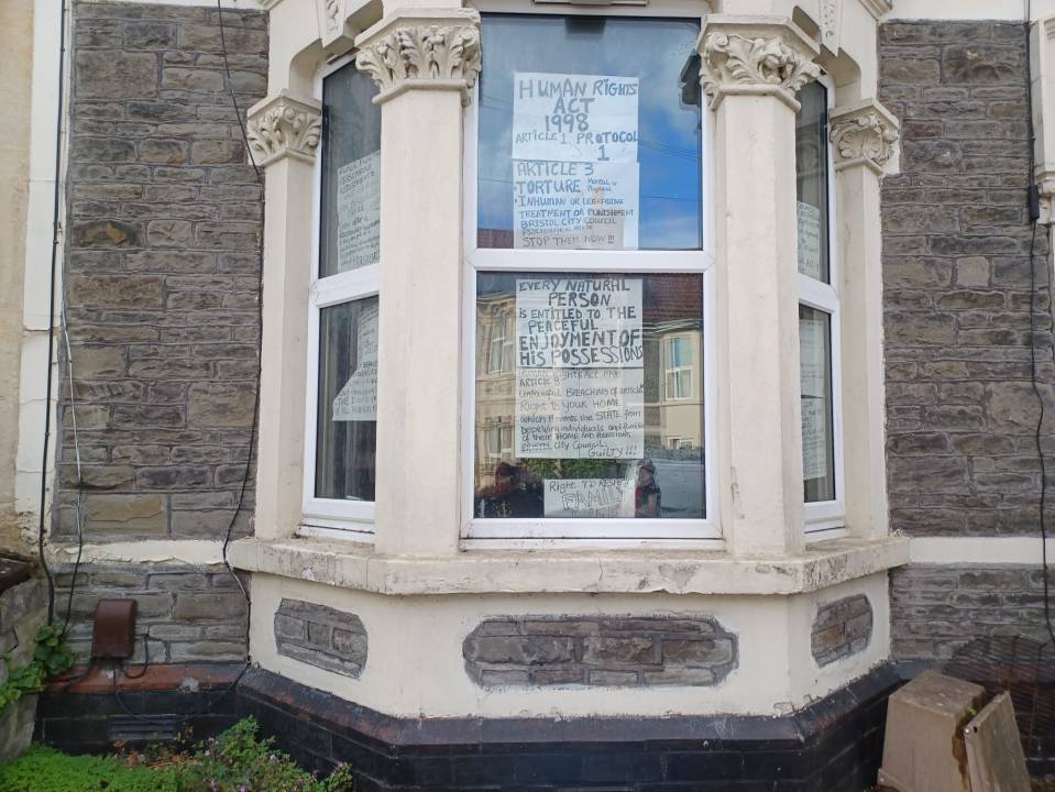 The doors and windows of the mum's house have now been boarded up