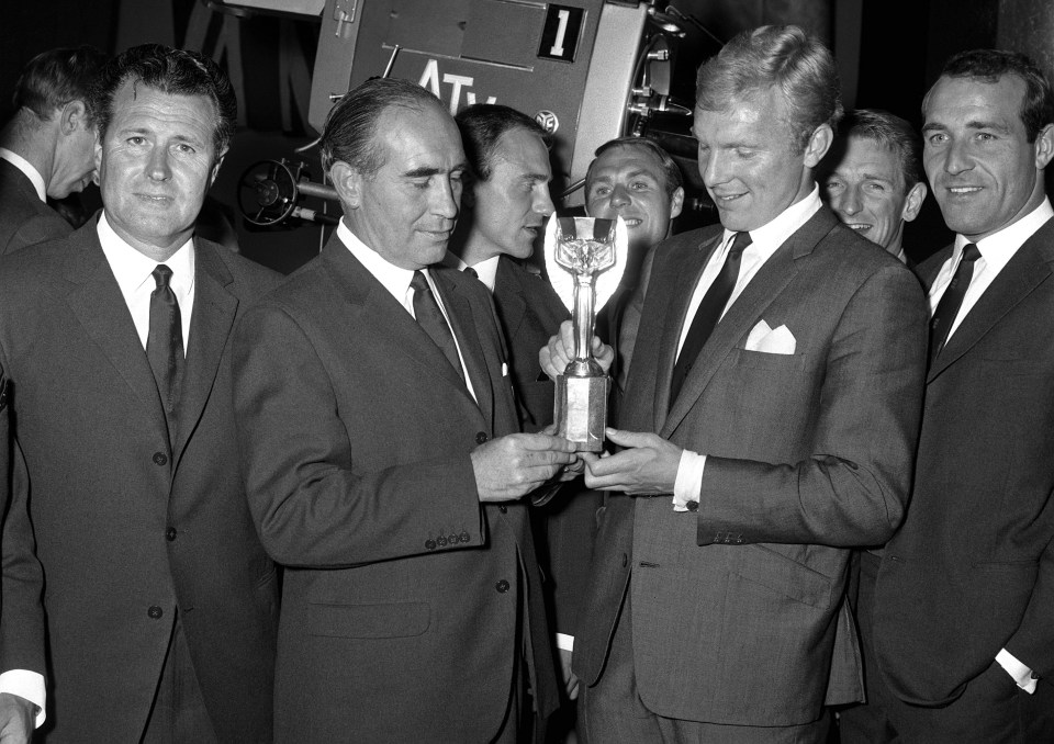 England manager Sir Alf Ramsay, captain Bobby Moore and teammates at a lunch the day after they won the trophy