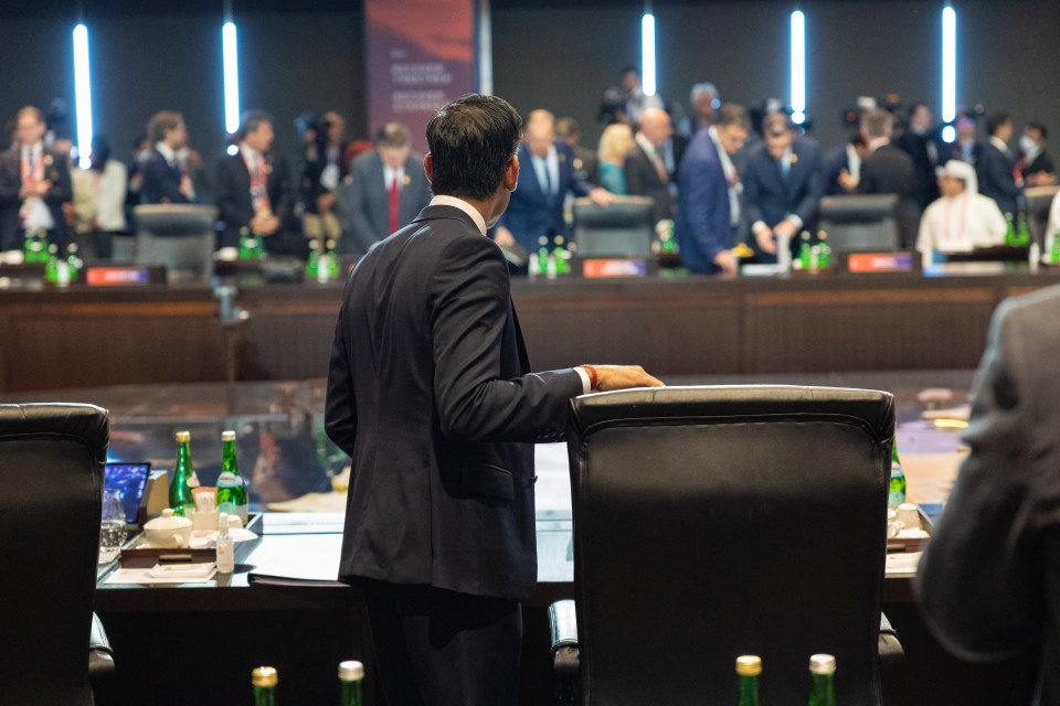 Rishi Sunak stares across G20 meeting room at Russian Foreign Minister Sergey Lavrov