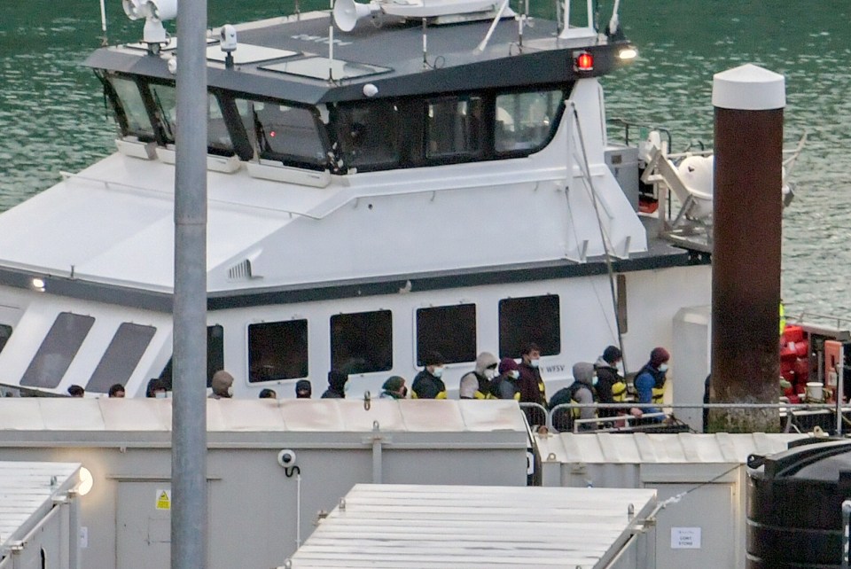 Migrants being escorted ashore in Dover today