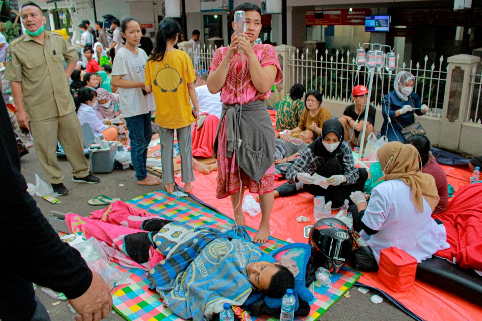 Earthquake survivors being treated outside a hospital in Cianjur