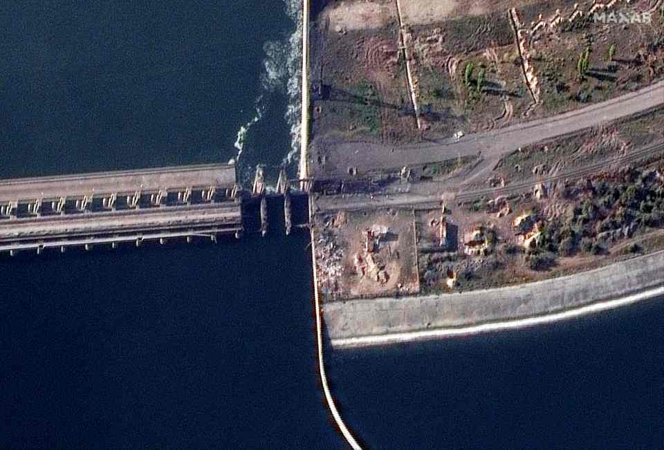 Satellite images released and collected by Maxar Technologies appear to show damage to the Kherson dam