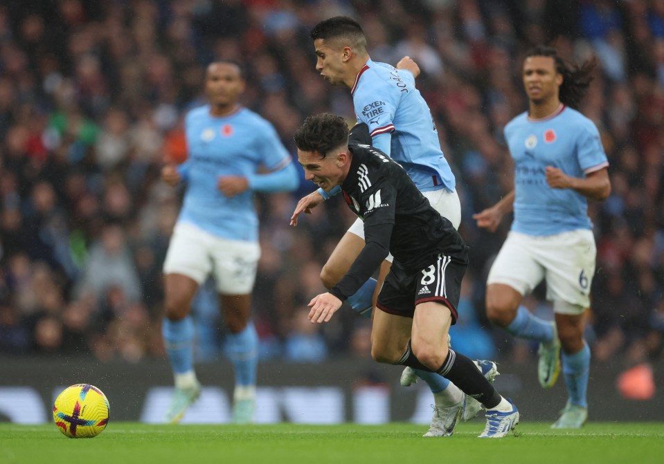 Wilson went down after contact from Cancelo inside the penalty area