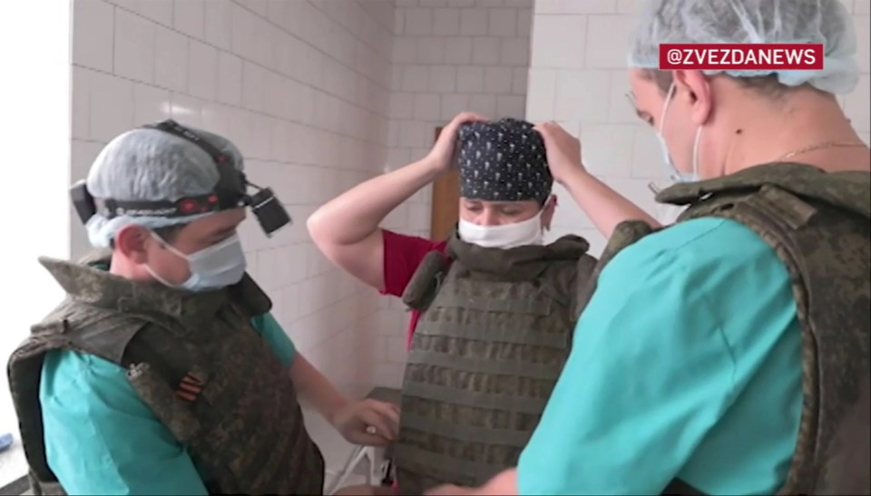 Russian medical surgeons donned military armour for the op