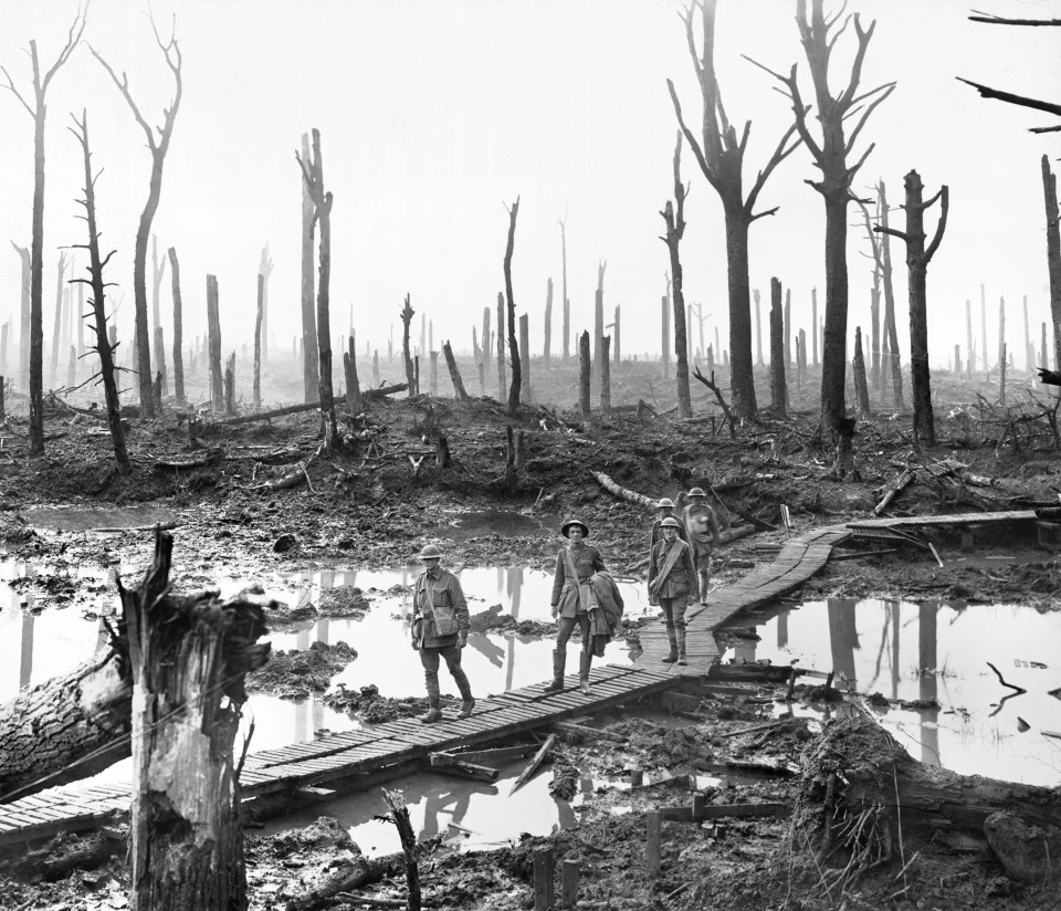 Soldiers wading through rivers of mud in the village of Passchendaele, Belgium