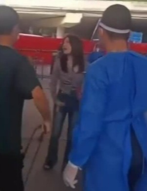 A Chinese woman was forced to the ground and had her hands tied after clashing with Covid enforcers