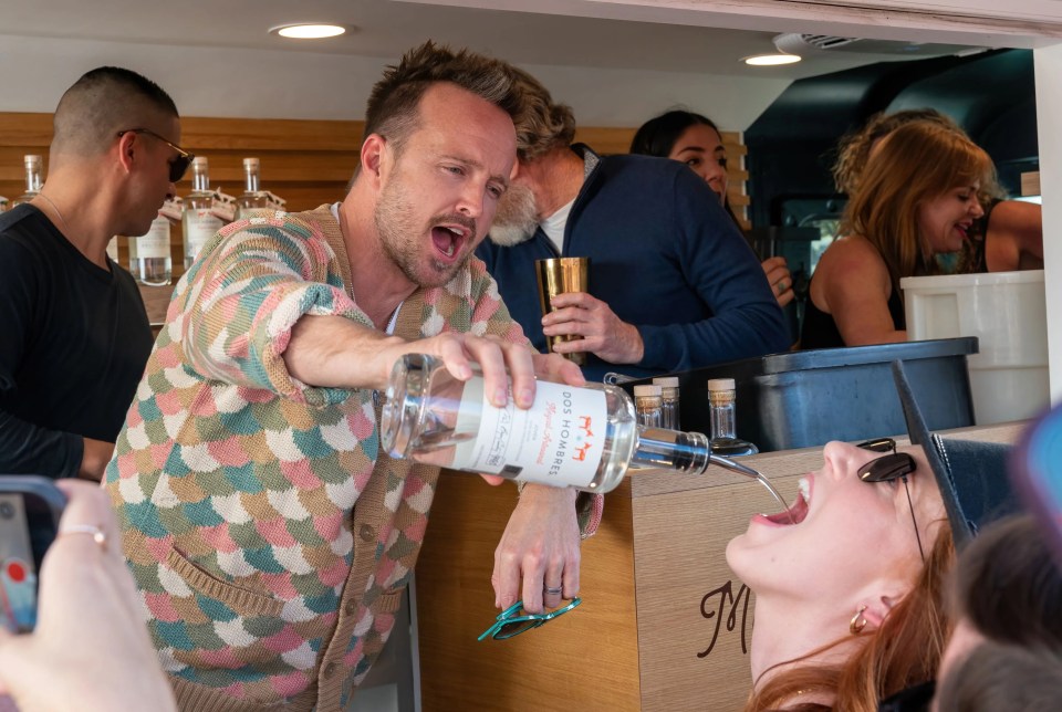 The Breaking Bad stars decanted bottles of their Dos Hombres mezcal into guests’ mouths