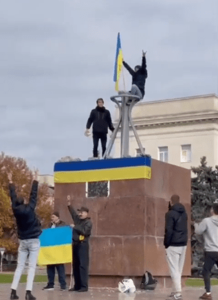 Cheering crowds welcomed Ukrainian troops into Kherson on Friday