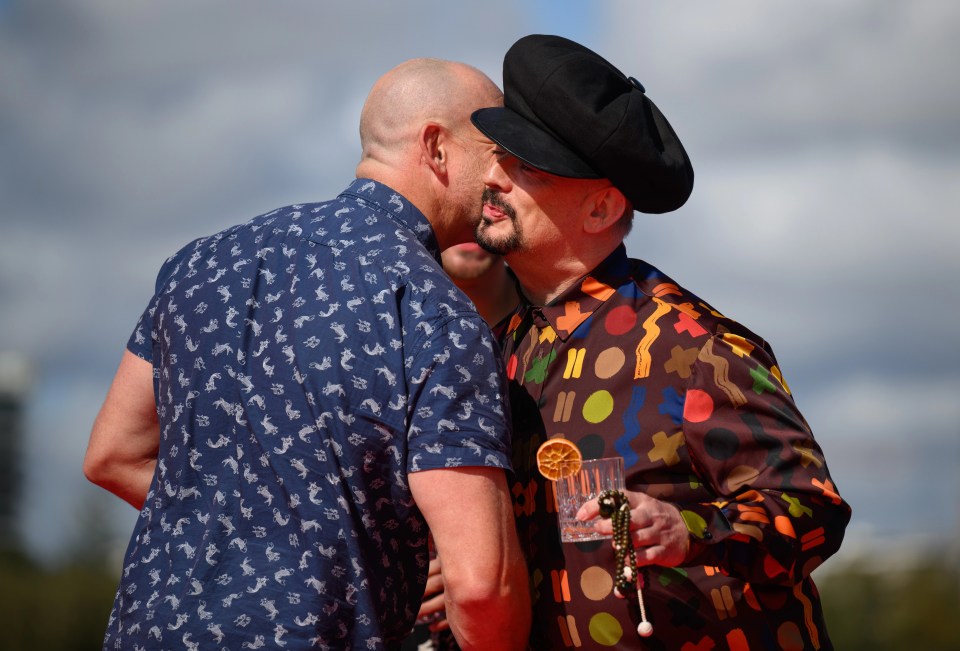 Mike Tindall and Boy George greet each other