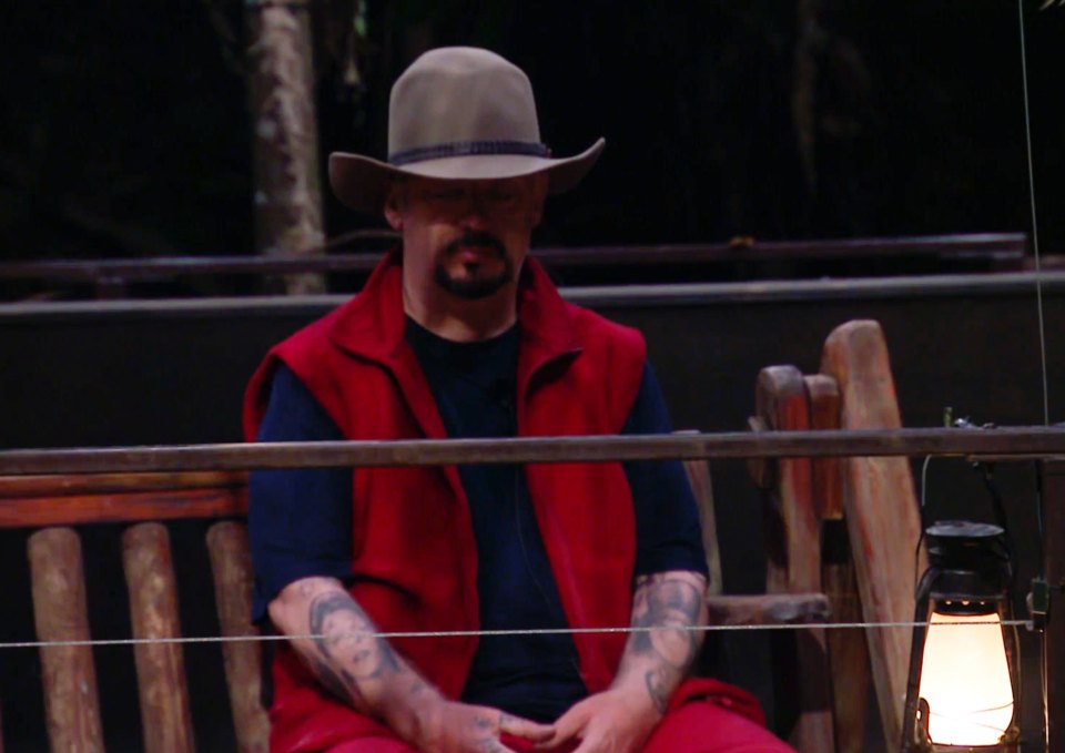 Furious Boy George sat alone after a tense dinner