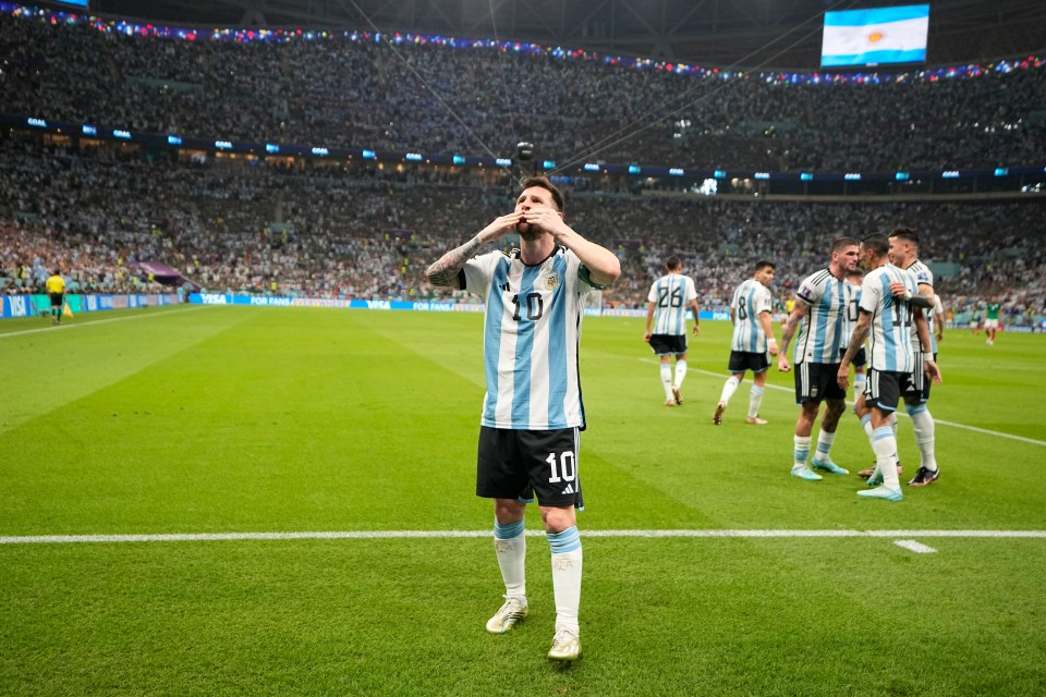 Lionel Messi celebrates his stunning opener against Mexico