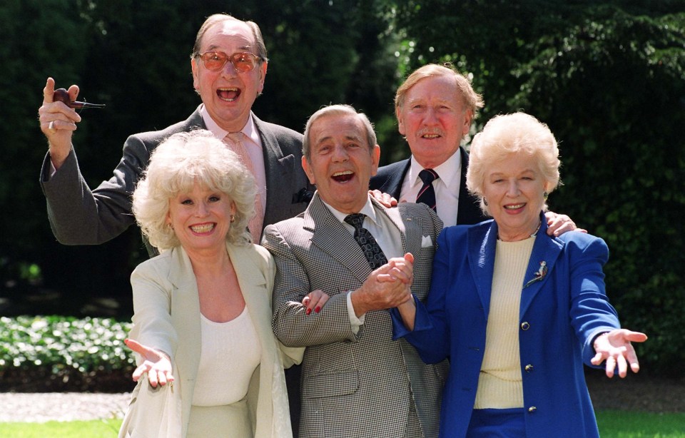 Leslie and his Carry On co-stars Jack Douglas, Barbara Windsor and June Whitfield pictured with actor Norman Wisdom (centre)