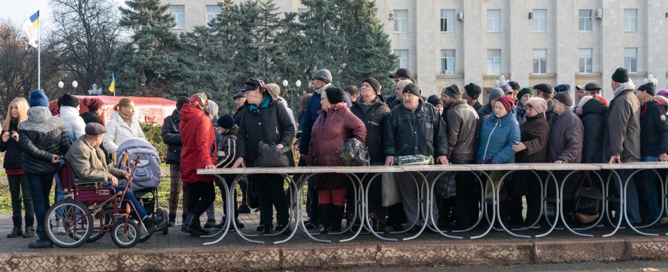 Residents queue for aid deliveries in Kherson's main square