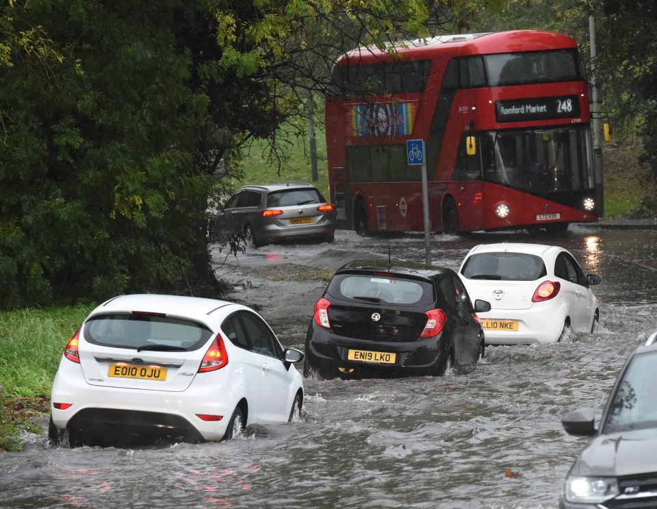 Motorists struggling through the floods in Hornchurch, London