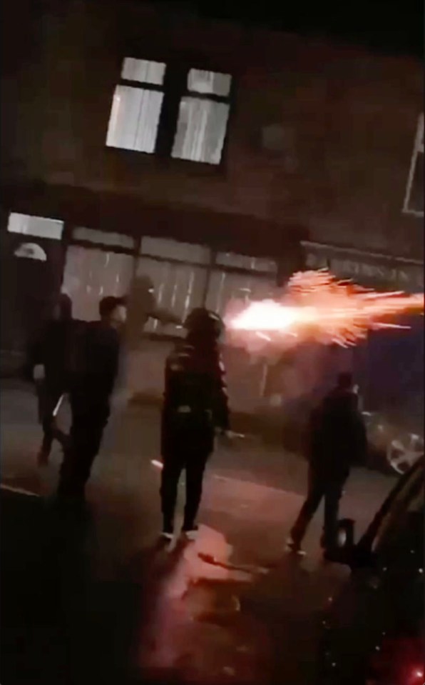 Yobs were seen 'hurling' fireworks down a street in Halifax, West Yorkshire