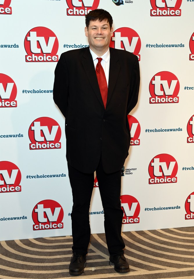 Mark was wearing a black suit with a red tie as he was snapped leaving the awards ceremony