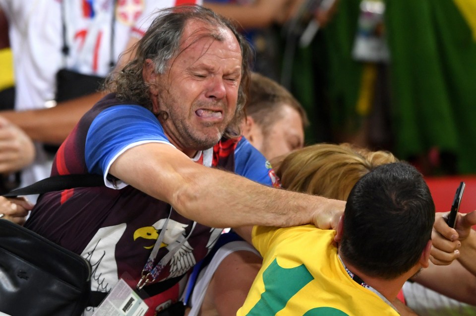 Fans of Brazil and Serbia fight in the stands as the two sides met in 2018