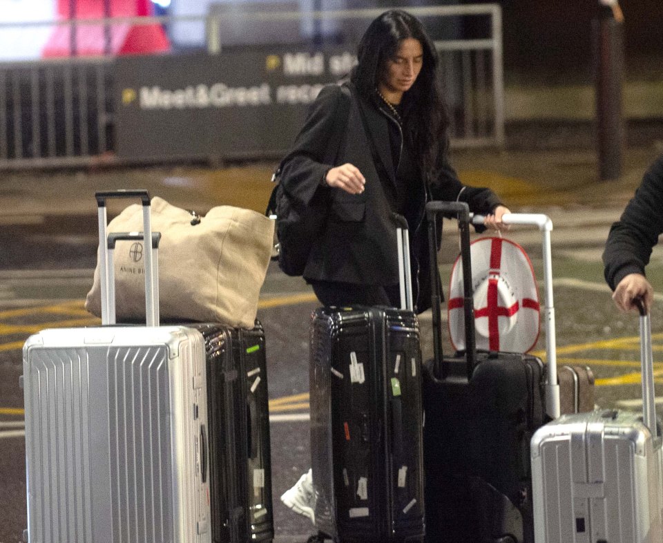 Kyle Walker's missus Annie pictured with a England hat and multiple suitcases