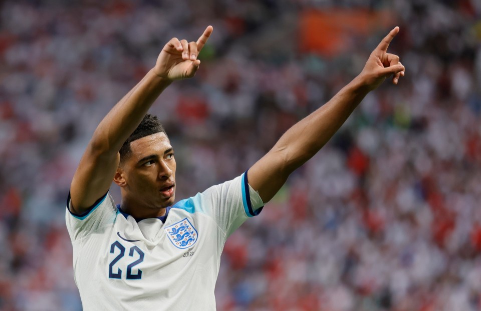 Jude Bellingham celebrates after scoring England's first goal at the World Cup