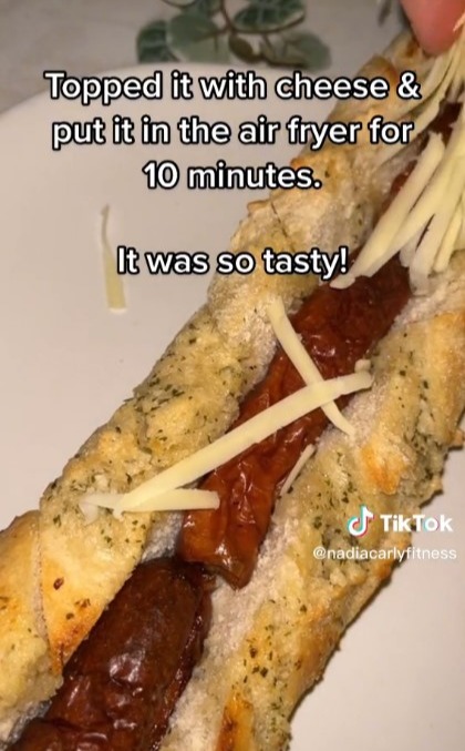 She put three sausages in the centre of a garlic baguette and topped with cheese