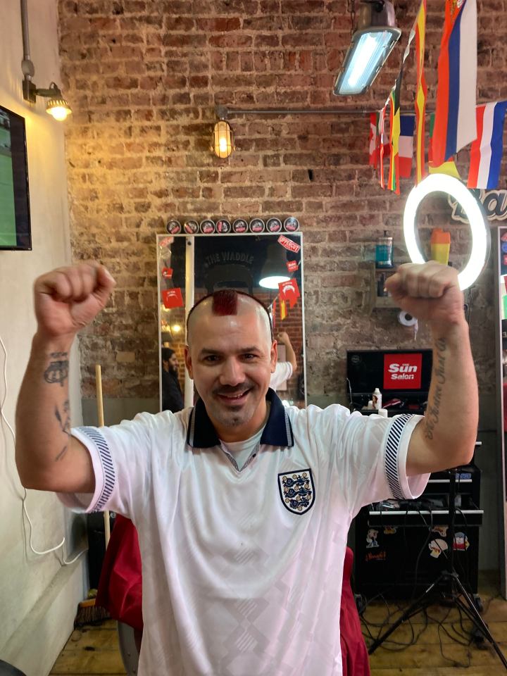 Sun reader Relu Ichim cheered on England after getting the flag on his head