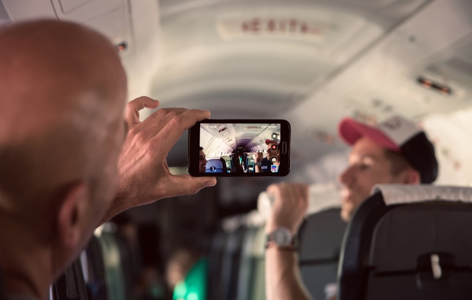 Flight attendants also hate it when passengers take photos of them on the plane