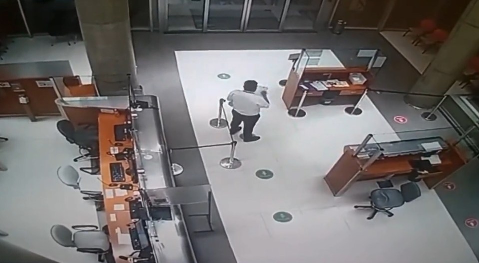 The hospital worker can be seen taking down notes on a clipboard