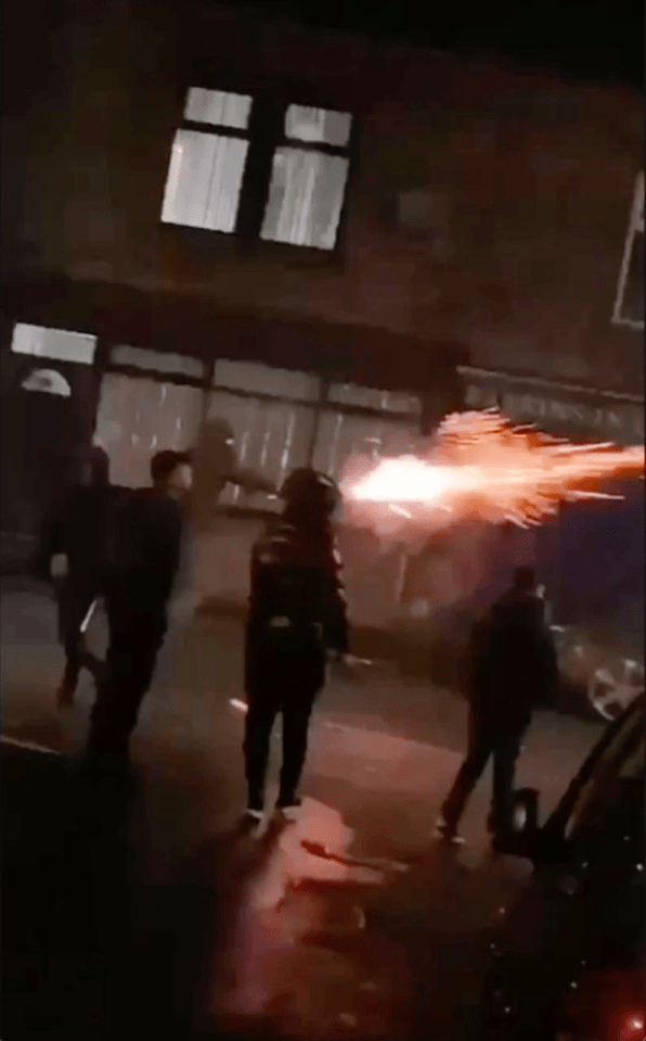 Yobs were seen 'hurling' fireworks down a street in Halifax, West Yorkshire