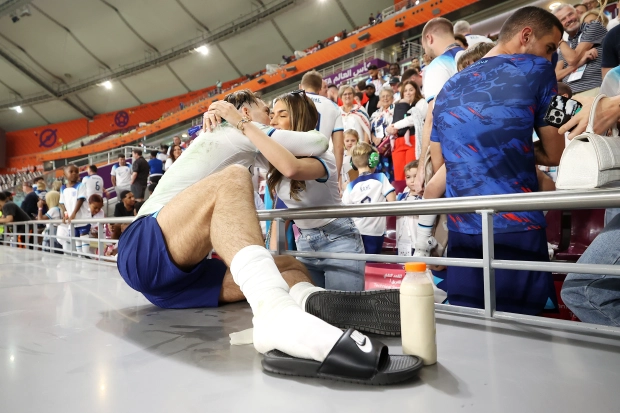 Jack Grealish embraces Sasha Attwood after England's win over Iran