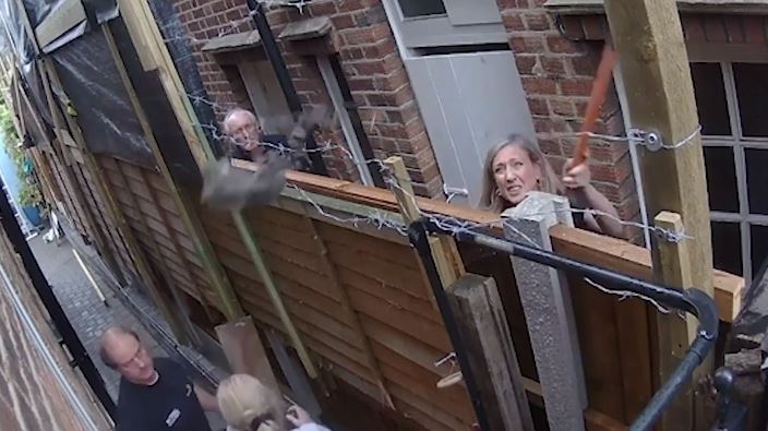 CCTV footage seems to show her lobbing bricks over the fence, almost hitting Sandra