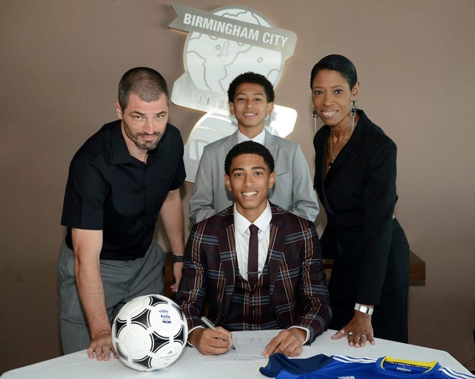 Jude with his family signing for Birmingham City in 2019