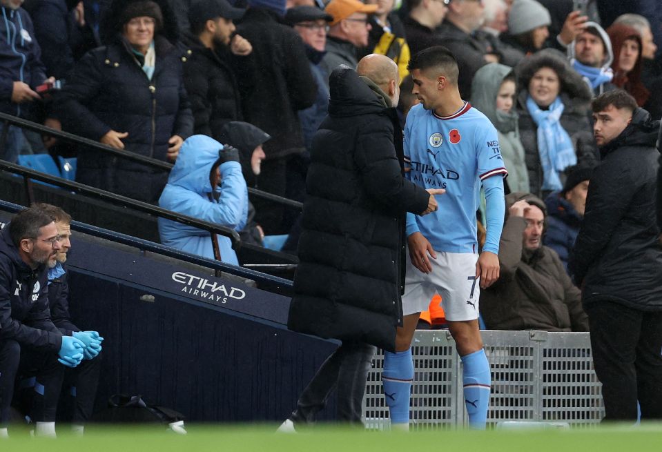 Guardiola grabbed hold of Cancelo as he made his way off the pitch