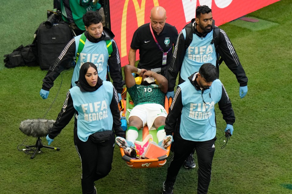 Yasser Al-Shahrani was carried off on a stretcher after taking a knee to the head