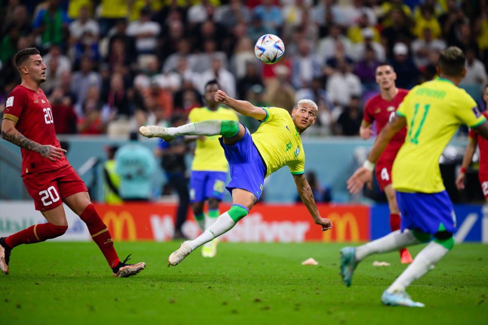 Richarlison twists for the goal of the tournament so far to complete his double and seal Brazil's victory