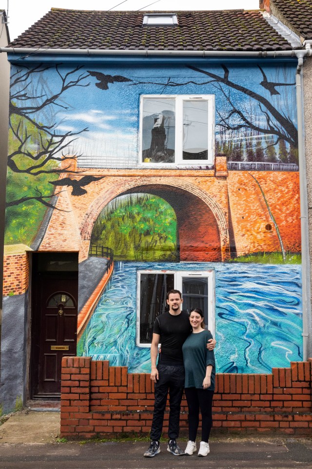 Nick Underwood and his wife Megan outside their newly-painted house