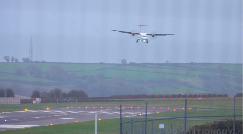 The plane was seen struggling to stay on course s it swayed in the sky amid high winds