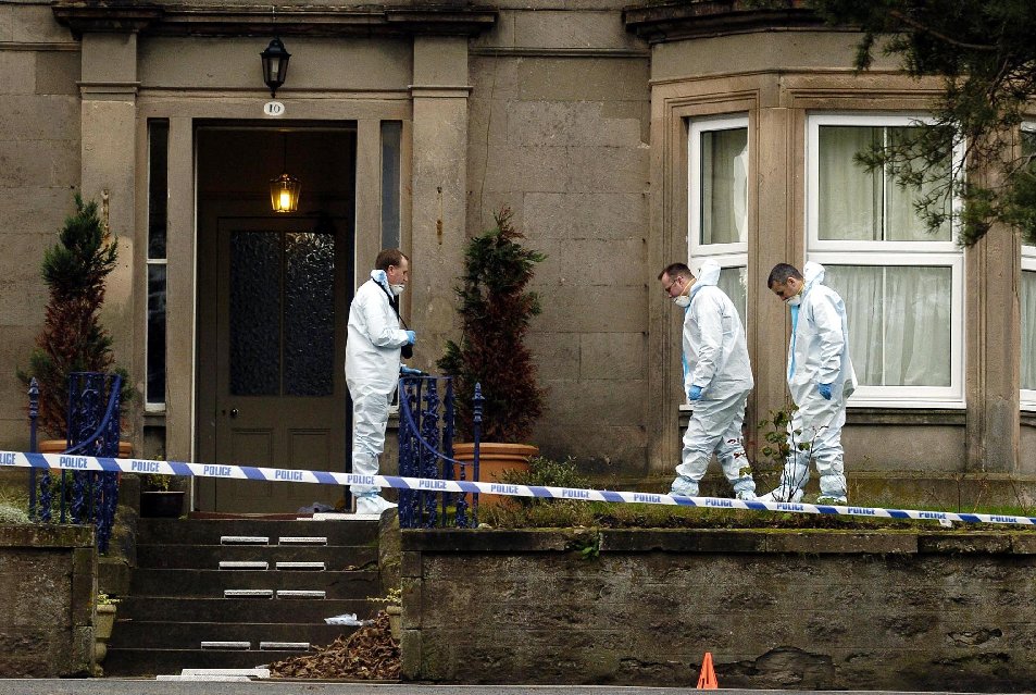 Forensic teams examine the front garden