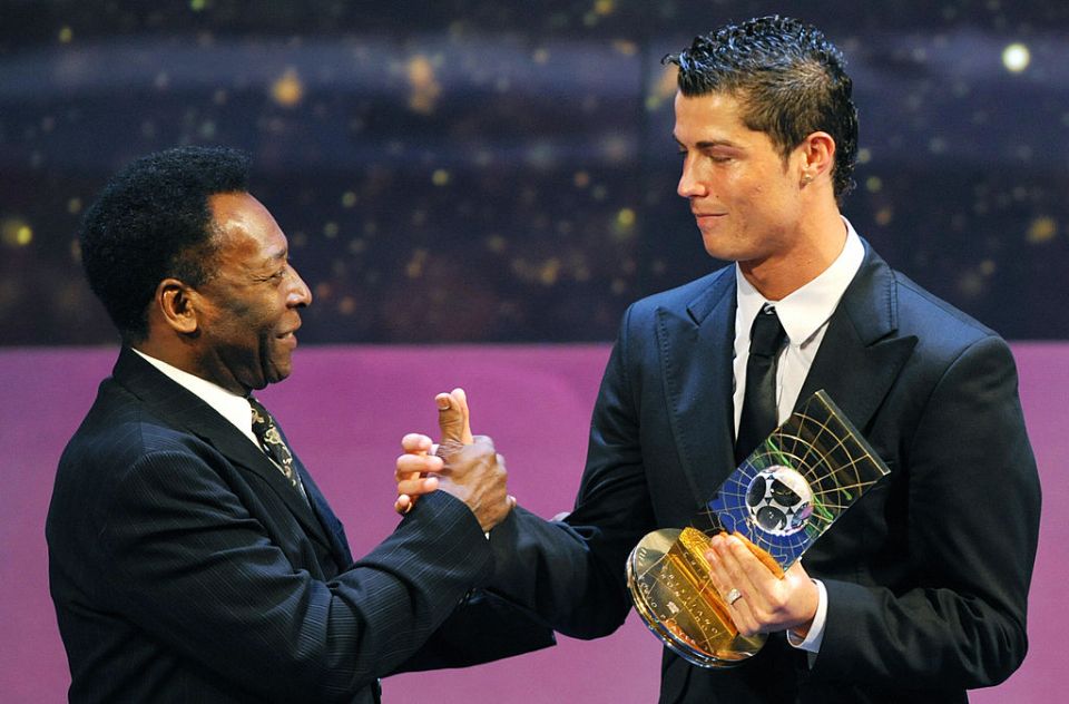 Pele shakes hands with Cristiano Ronaldo