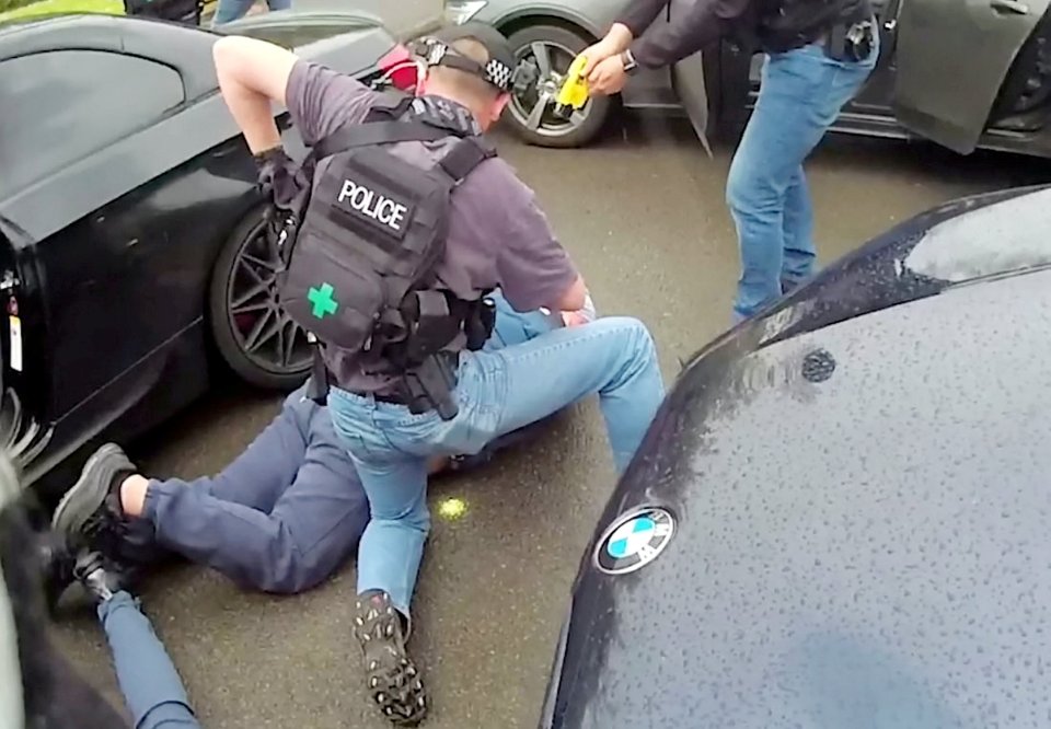 Bodycam footage shows the moment one gangster is dragged out of a black BMW