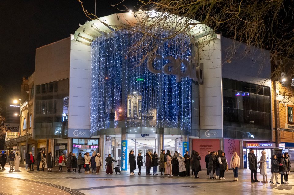 Shoppers queuing in Cardiff this morning