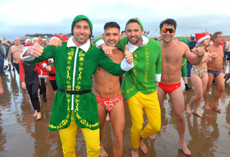 A group of lads dressed in elves at the Christmas swim