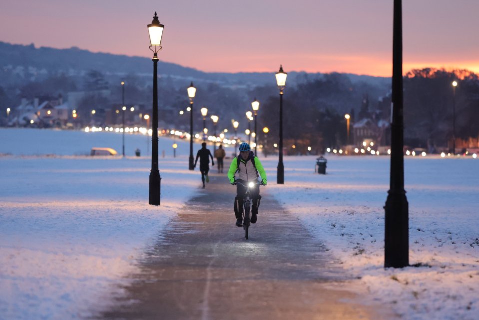 People walking and cycling across Blackheath Common in London on Tuesday morning