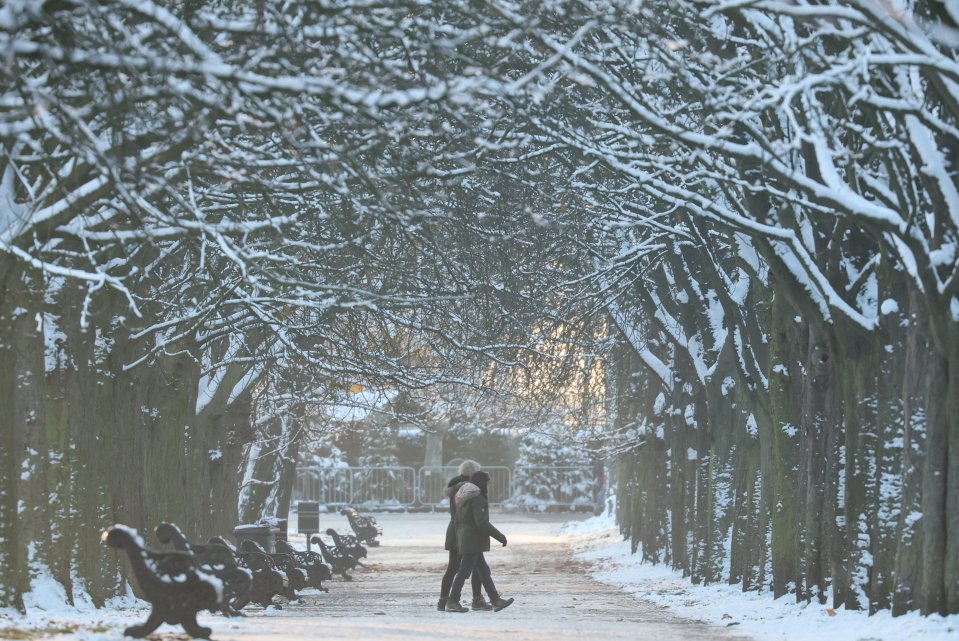 People braved the weather in Greenwich Park, London, this morning