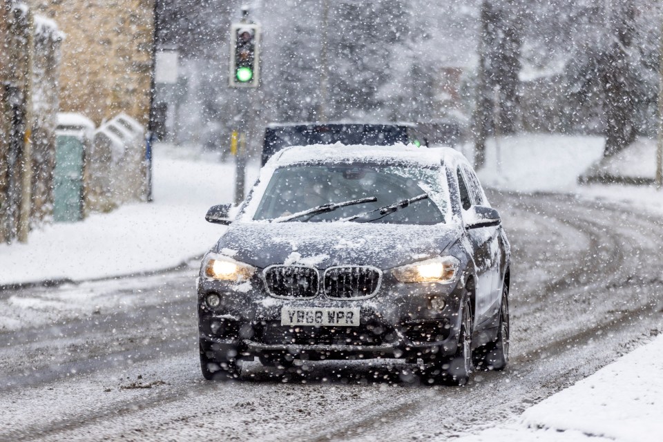 A snow covered car battles the elements in North Yorkshire