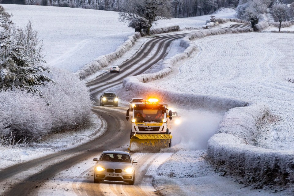 A snow plough works on the road this morning in North Yorkshire