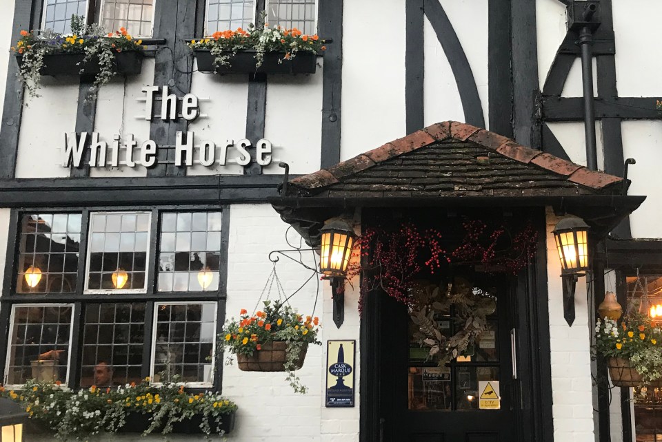 Customers at The White Horse can enjoy a pint on the same wooden bench as Jude Law did