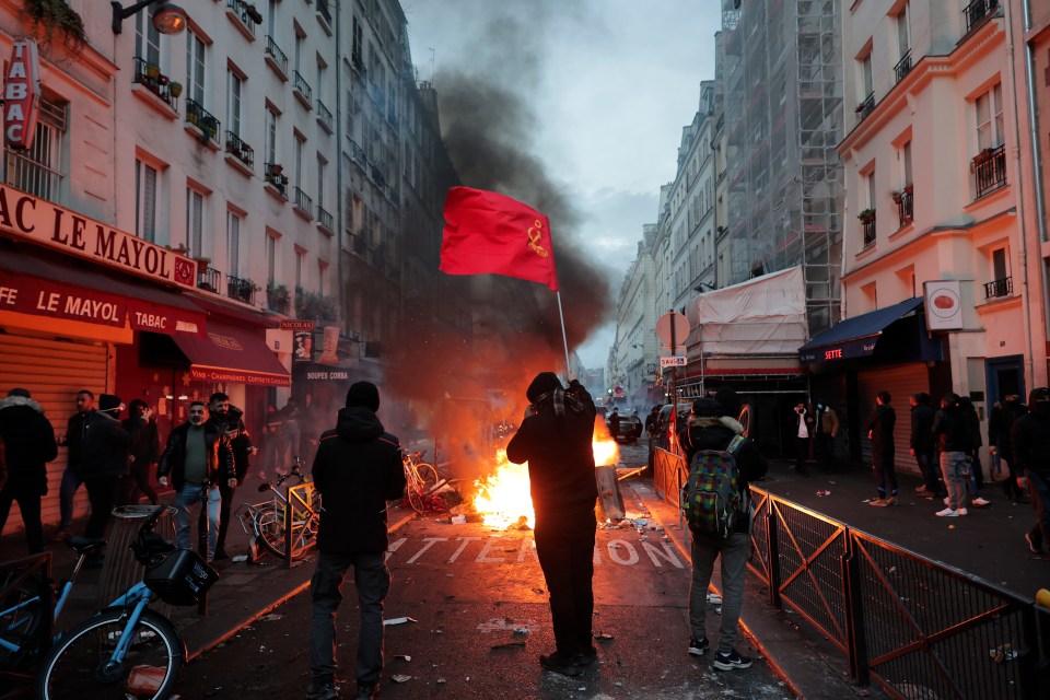 Protesters have started fires and hurled missiles at riot cops