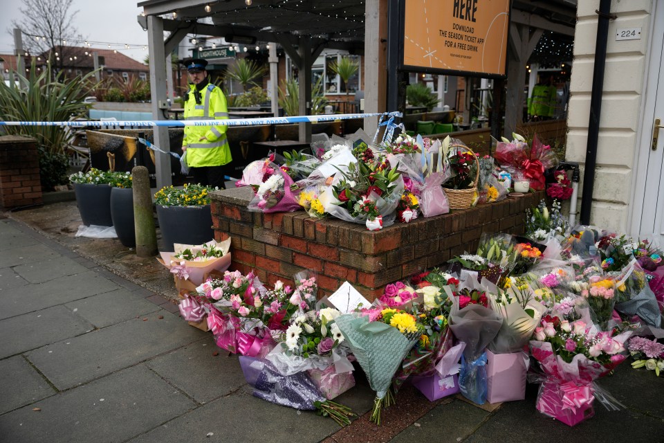 Locals have left flowers and cards outside the pub in her memory